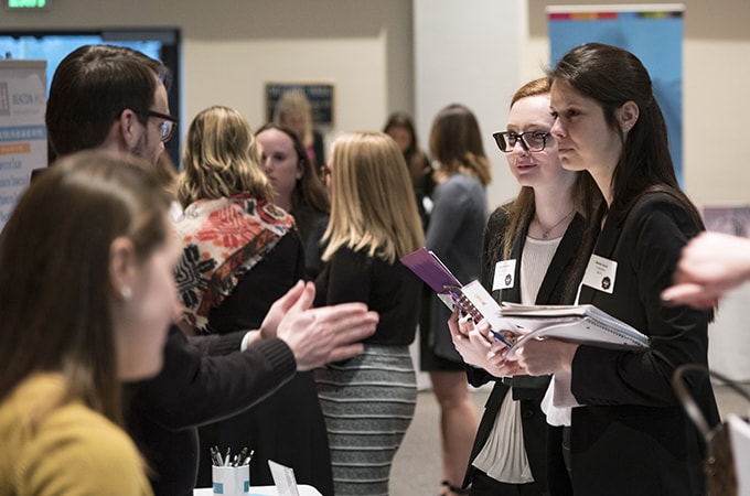 Students networking at one of Loyola's career fairs