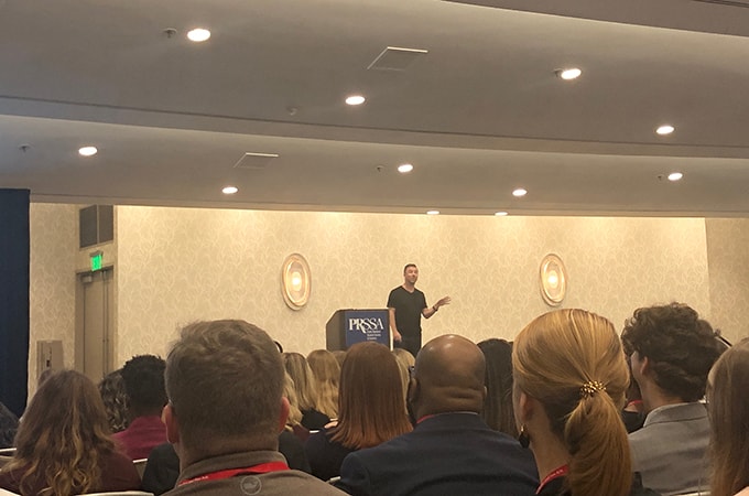 Speaker Will Collie on stage at the PRSSA International Conference in San Diego