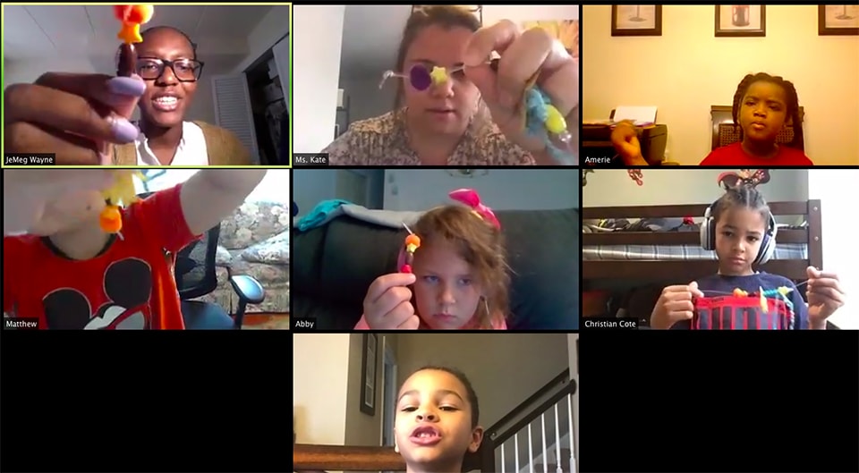 Screenshot of children working on arts and crafts projects on a Zoom conference