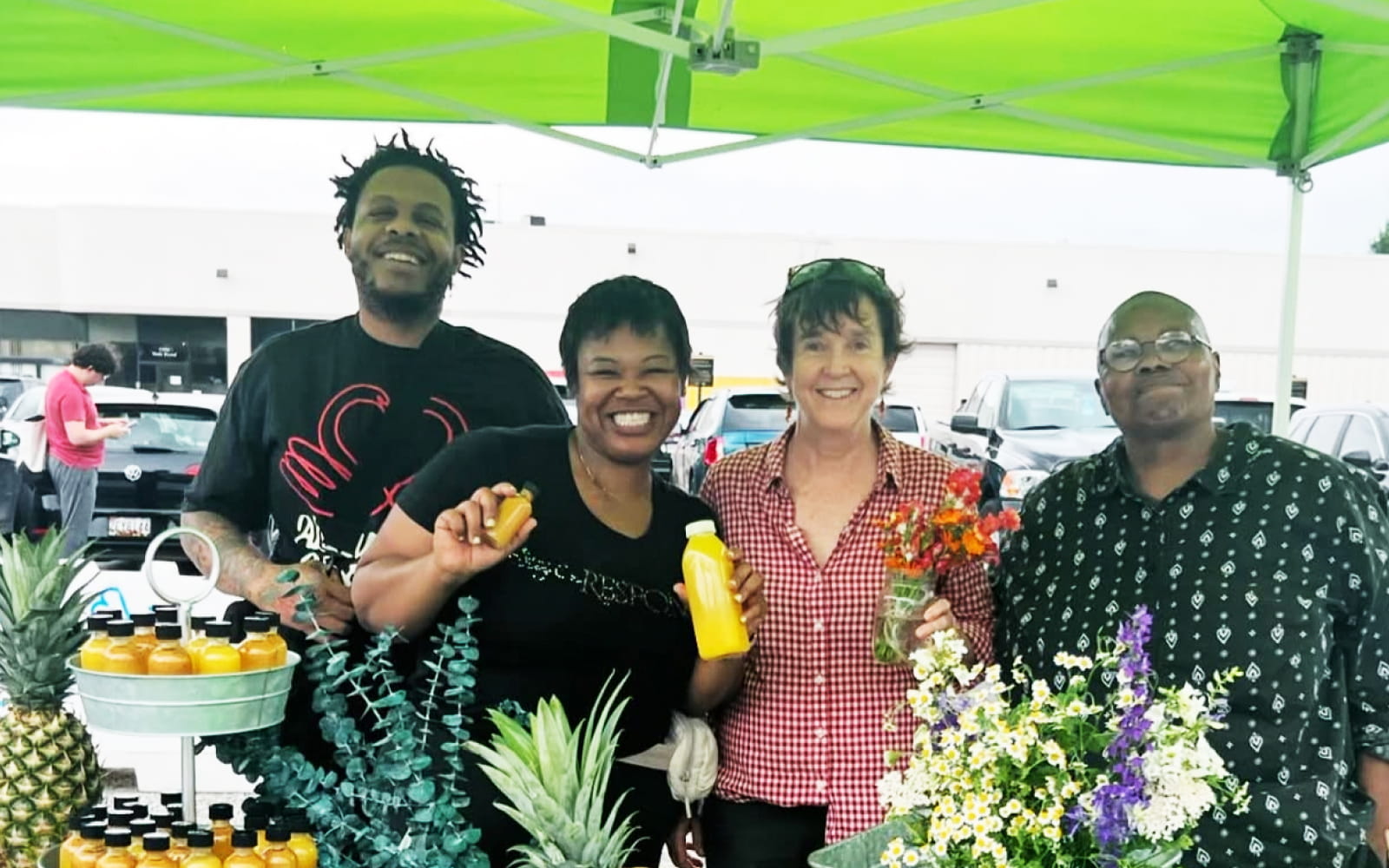 Local vendors smiling for a photo at the Govans Farmers Market