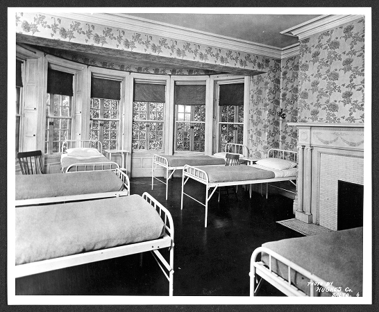 A room full of single beds in the Humanities Center