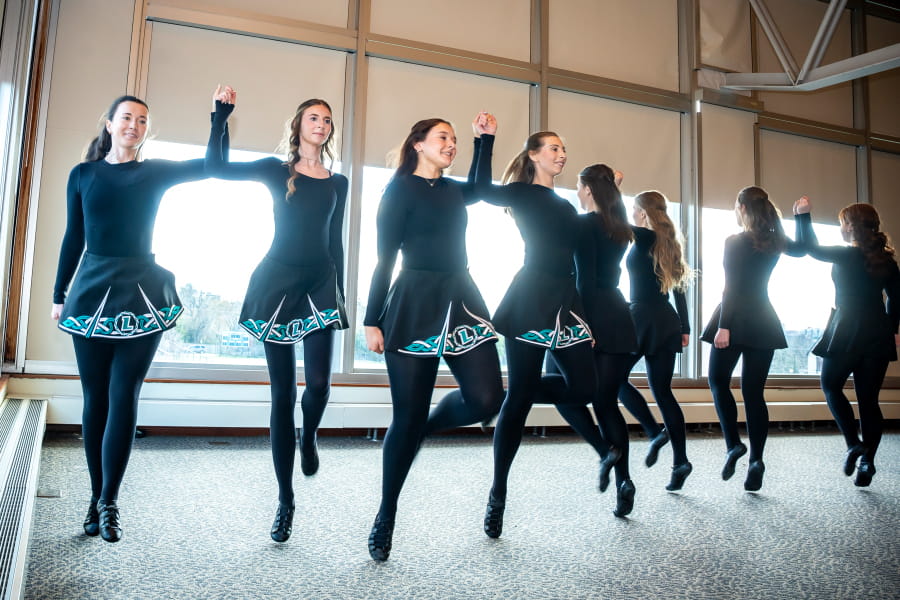 Members of the Loyola Irish Dance team performing traditional Irish dance. 