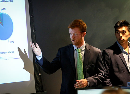 Two students giving a professional-level presentation.