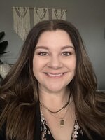 Jennifer Tranceto headshot of a lady with long hair, smiling