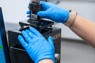 student working on a microscope