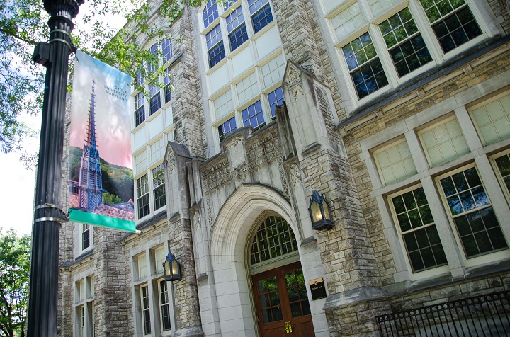 A Loyola banner hangs outside Jenkins Hall on the Evergreen campus