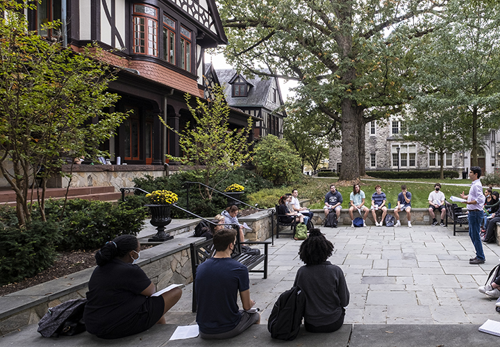 Students in class outside of the Humanities Building on the Evergreen campus