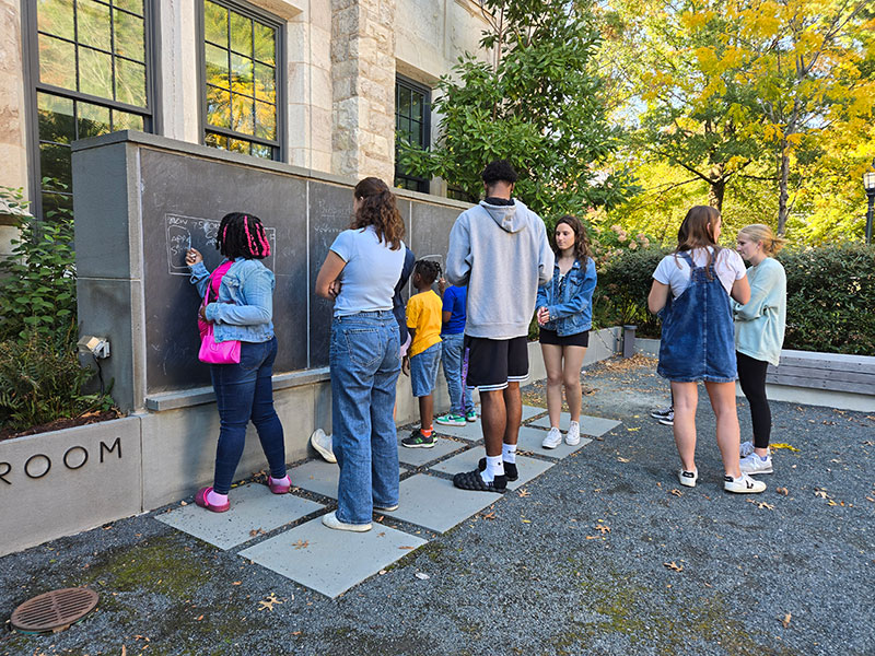 UP students and Loyola students at the Kelly Family Outdoor Classroom.