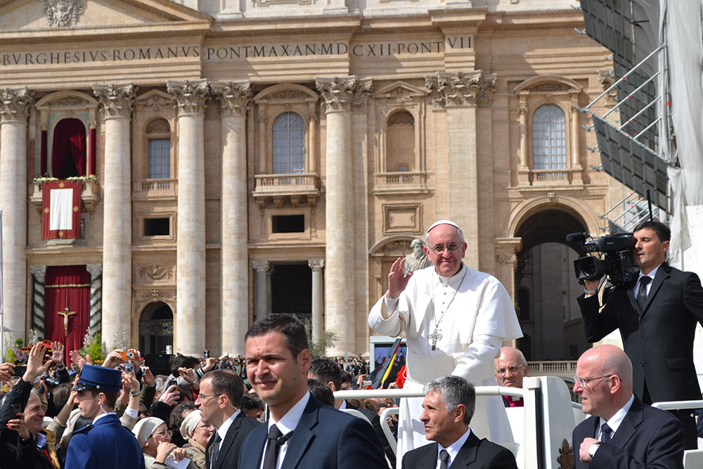 Pope Francis waves to the crowd at St. Peter