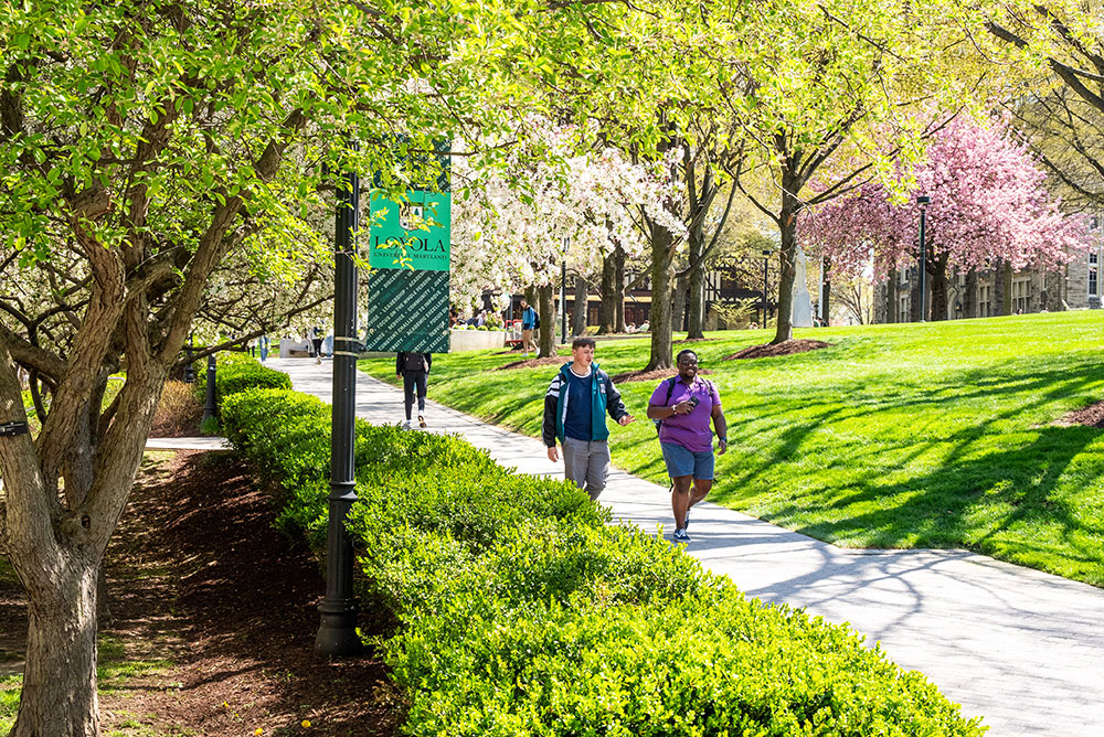Students walk across Loyola