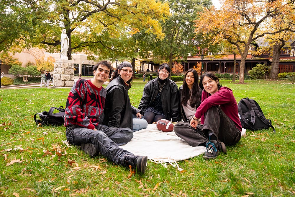 Students gather on Loyola quad in autumn