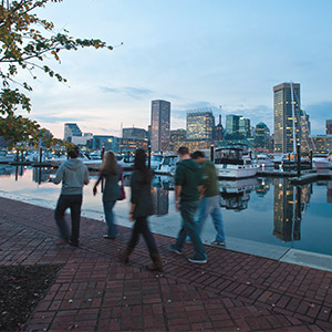Students walking along the bay in downtown Baltimore