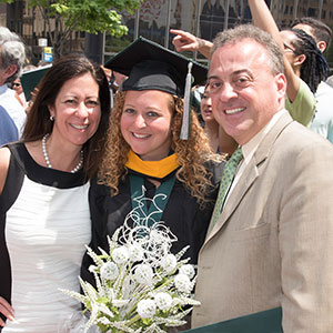 Parents with their daughter at graduation