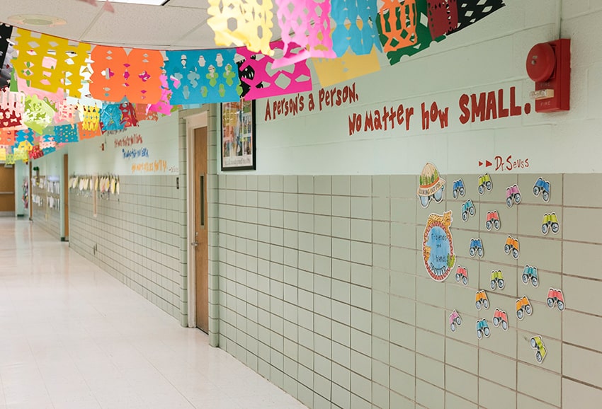 School hallway decorated in brightly colored artwork