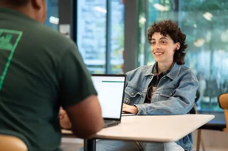Two students collaborate in a classroom