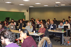 Conference attendees sitting and listening to speaker