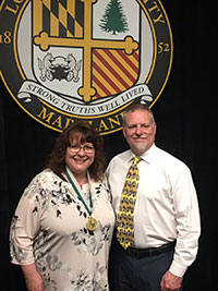 Pattie Holy-Ilenda standing with Dean Josh Smith