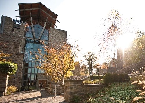 The exterior of the Sellinger Business School buidling in the fall.