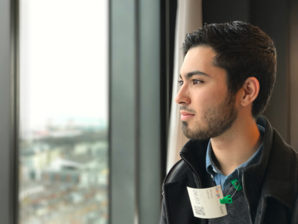 a student with a google name tag looks out the window