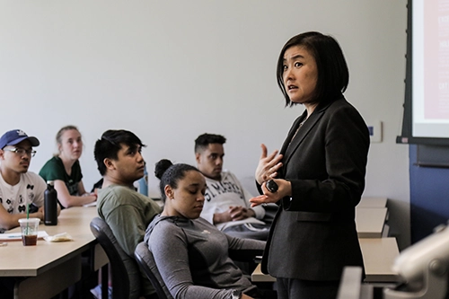 Loyola professor teaches a class of students